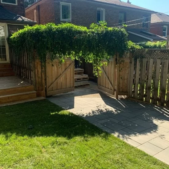 Landscape design with garden walkway and wooden gate, image by oakshs.ca