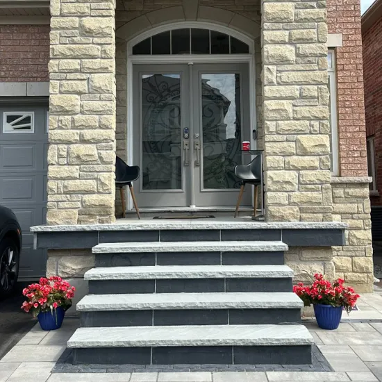 Landscape design with front entry steps and stone detailing