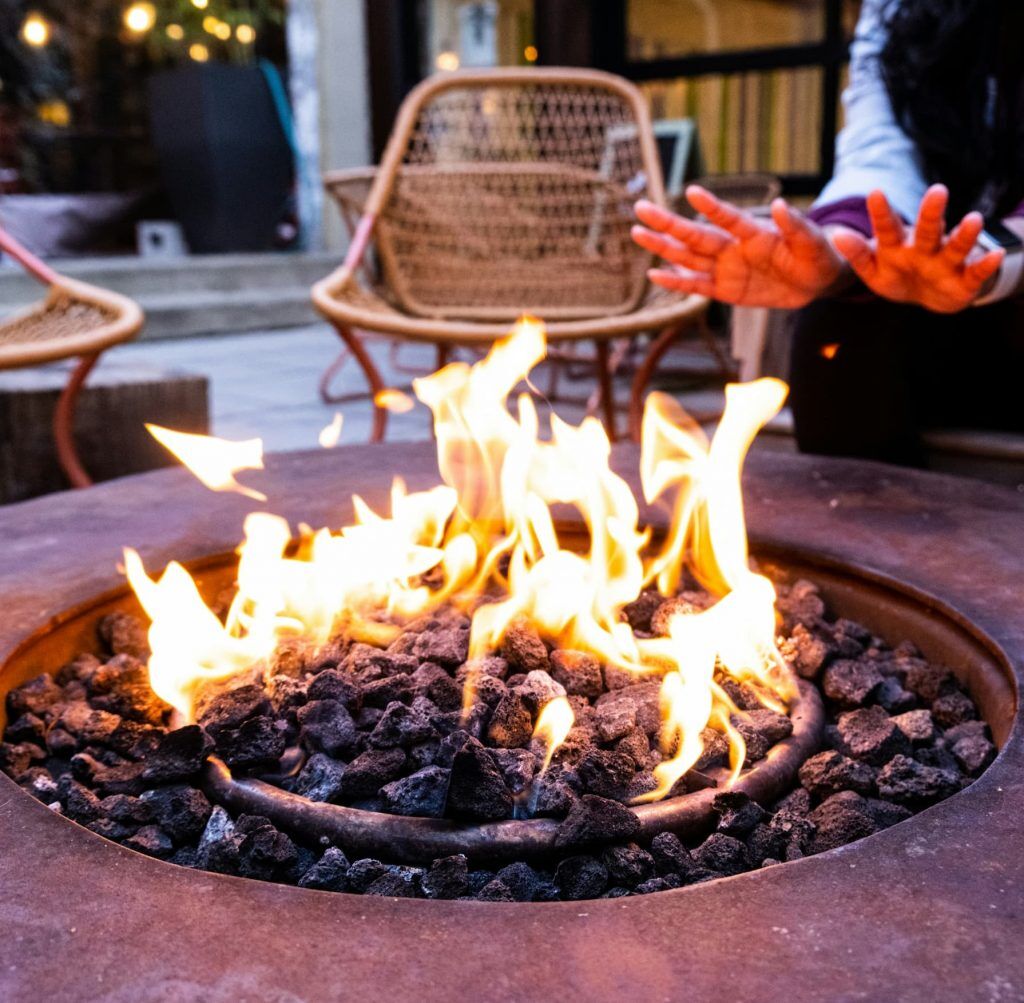 Landscape design with outdoor fire pit and seating area, image by oakshs.ca