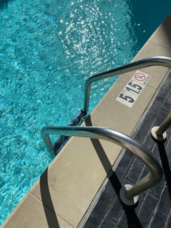 pool-coping-installation Expert coping and deck installation around modern pool, photo by Oaks Home Services