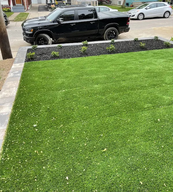 Landscape design with fresh lawn and planting border