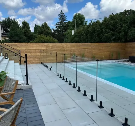 Toronto pool installation with modern stone deck, image by oakshs.ca