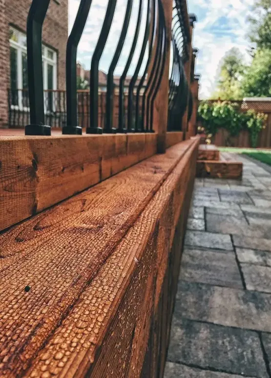 Close up of wooden deck railing and steps highlighting deck design