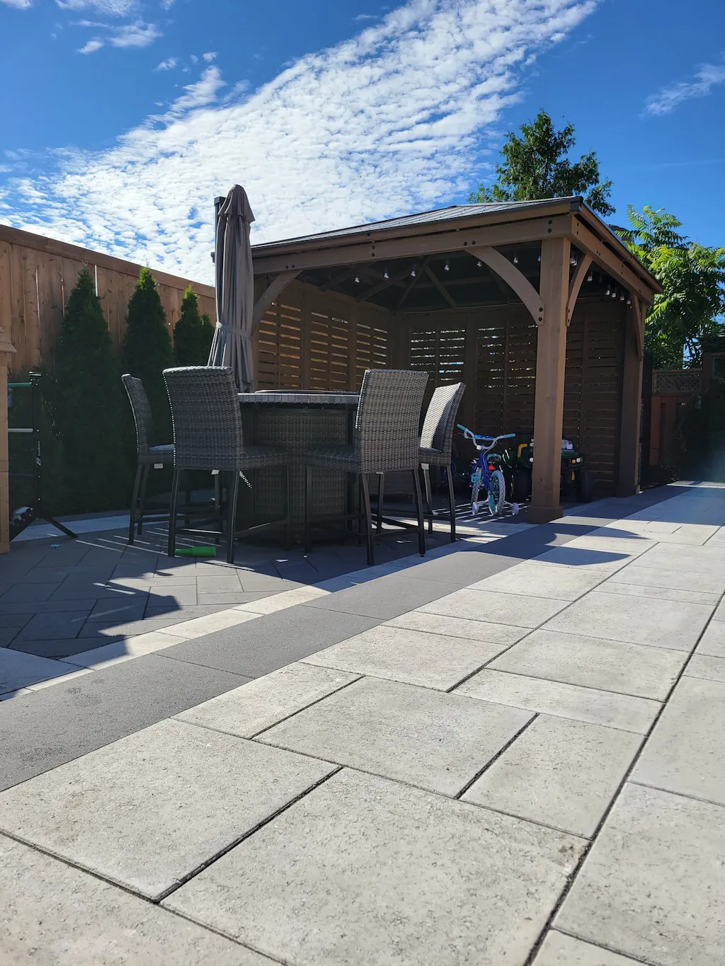 backyard wood gazebo with covered patio dining area and outdoor table seating