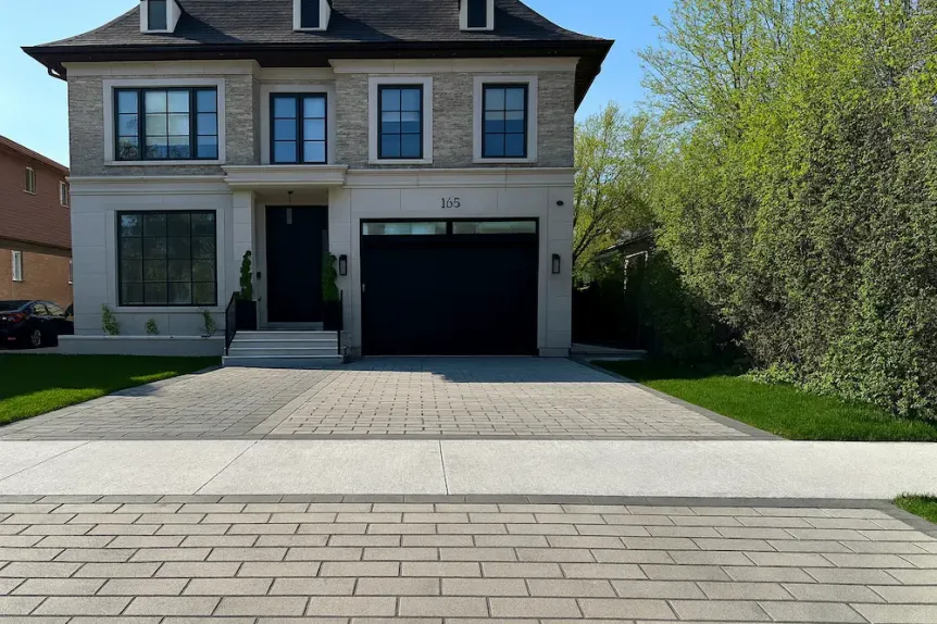 Contemporary Toronto home with clean line interlock driveway in neutral grey tones
