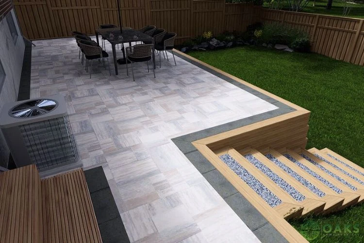 Backyard interlocking patio with raised dining area and modern step design