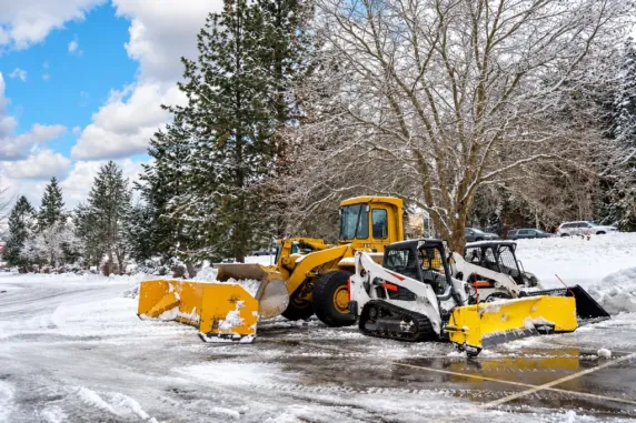 Snow removal fleet with loaders and skid steers, photo by Oaks