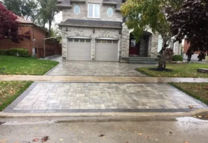 Interlocking stone driveway in front of a residential home, image by oakshs.ca