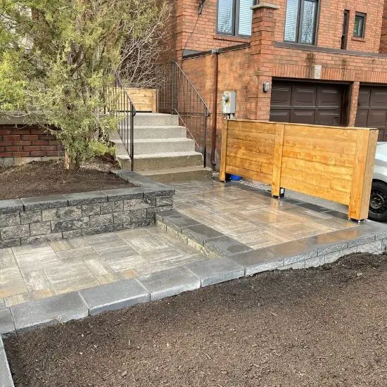 Interlocking Driveway Installation with Steps, Flower Bed & Fence