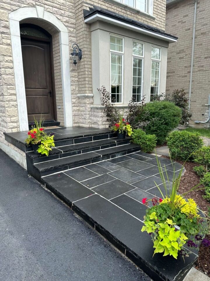 Interlocking front steps made from natural stone, image by OAKS Home Services