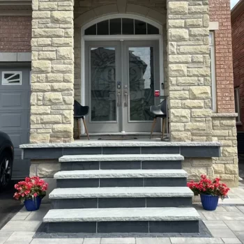 Landscape design with front entry steps and stone detailingLandscape design with front entry steps and stone detailing, image by OAKS Home Services