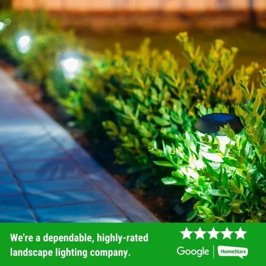 Landscape lighting along walkway of home.