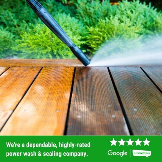 Contractor power washing a deck.