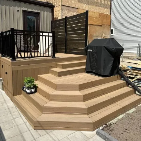 toronto deck builders Multi‑level composite deck with wide stepped platform and black railing
