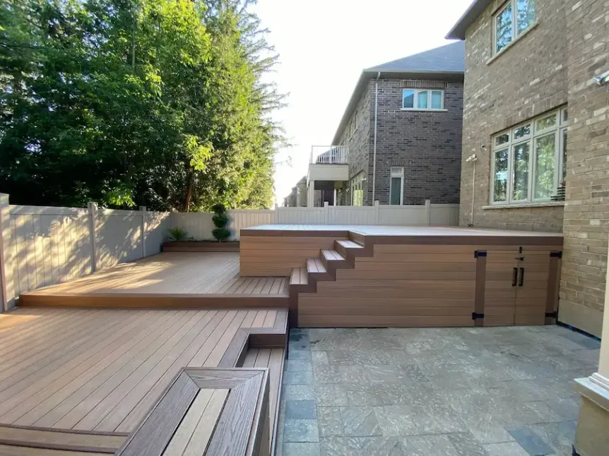 Multi-level wood deck with built-in steps and clean backyard layout
