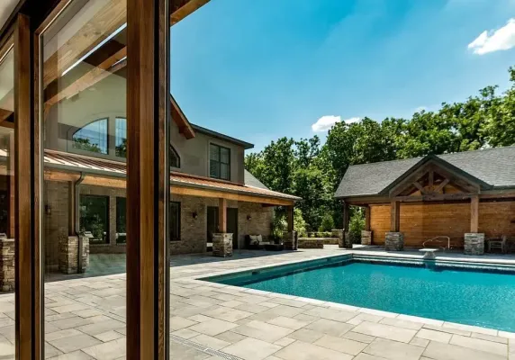 Interlock pool patio with light grey rectangular pavers, photo by Oaks Home Services