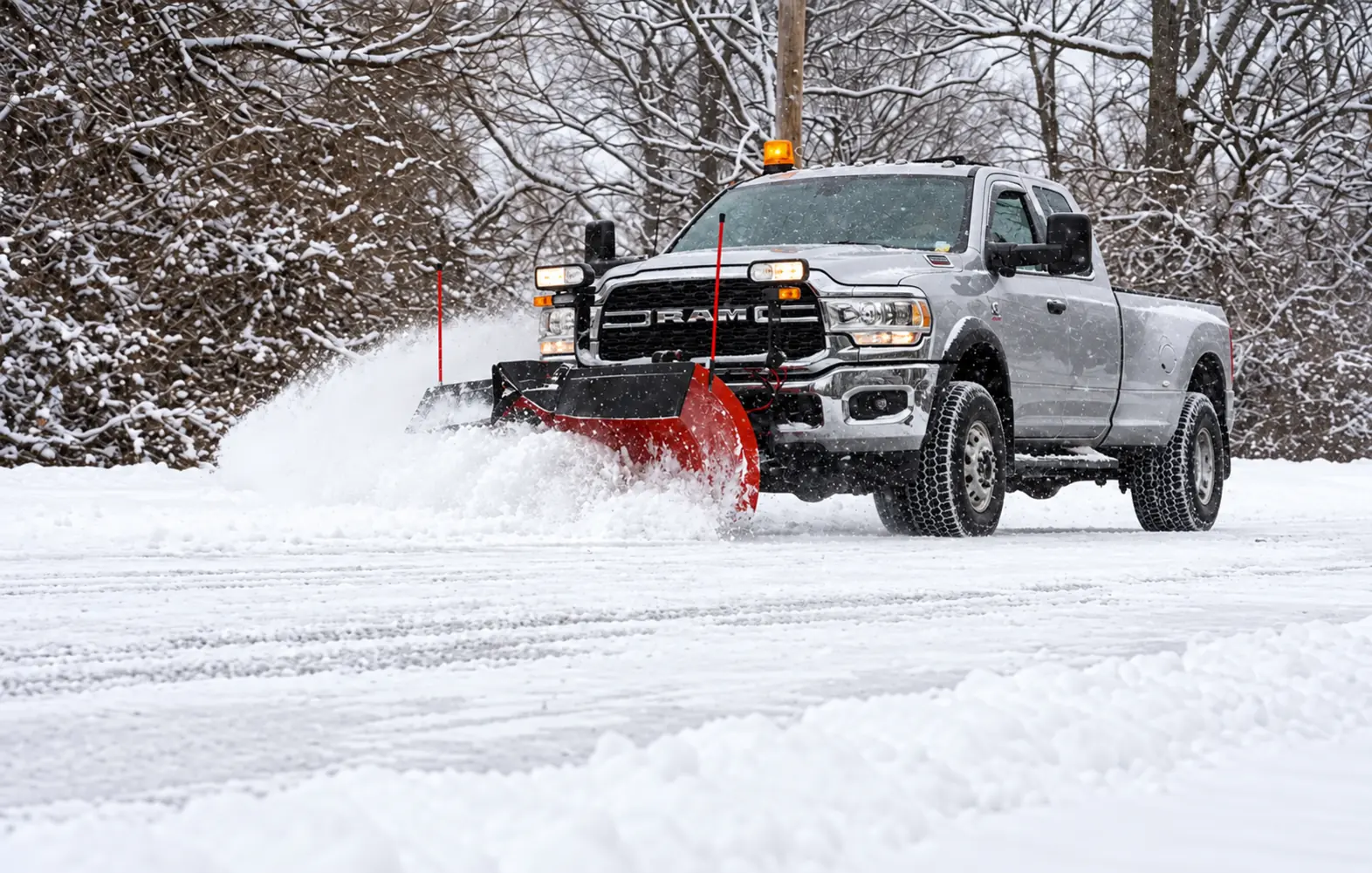 Silver Oaks RAM 5500 pushing snow with a V-plow, photo by Oaks