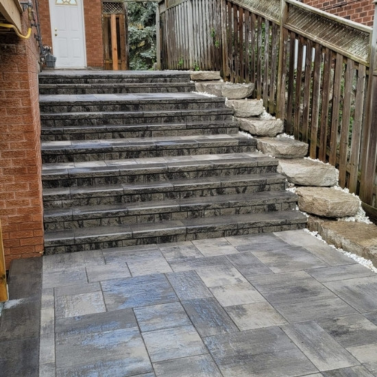 Side of a home with natural stone steps.