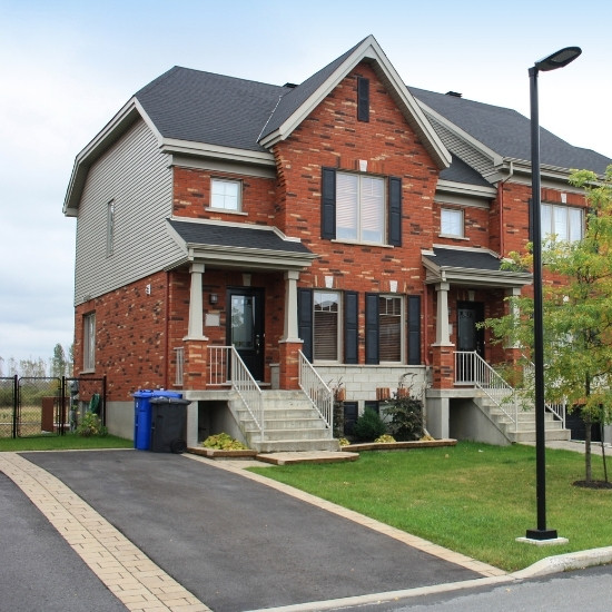 Home with asphalt paved driveway.