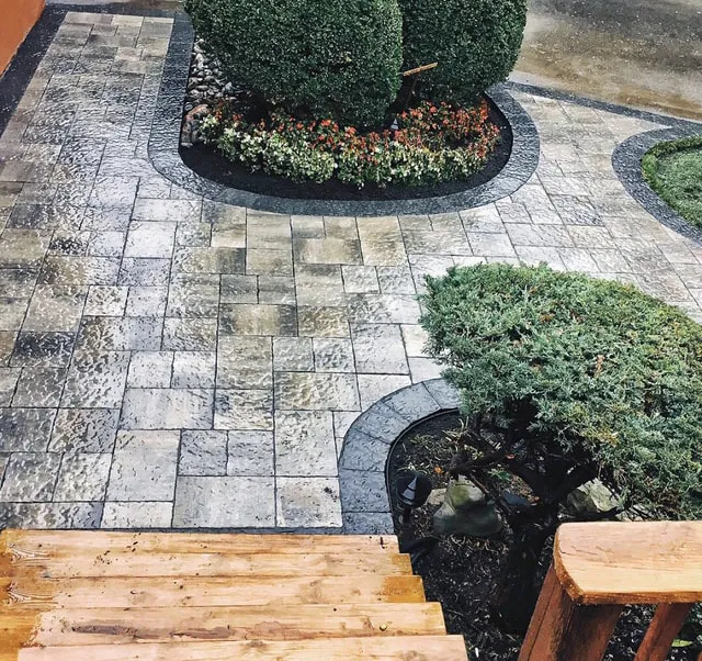 Stone walkway and planting layout by Oaks with curved edging