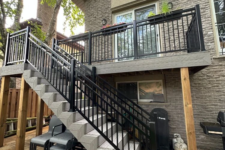 Elevated composite deck with sturdy railings and frost-resistant footings built for Toronto climate