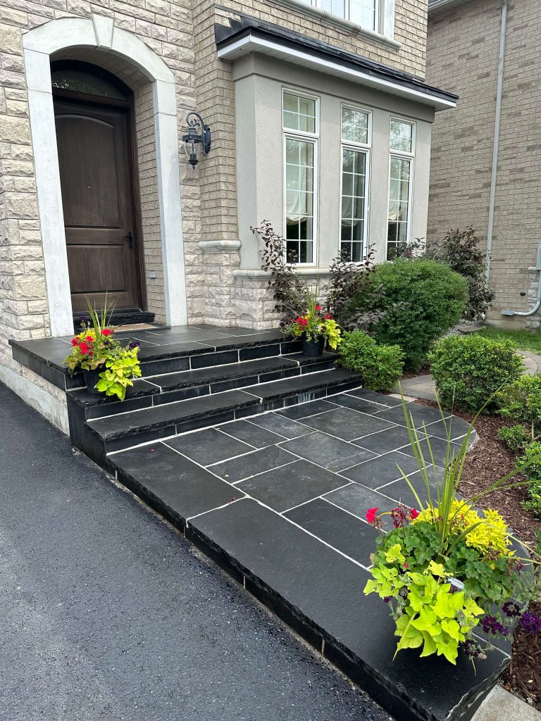 Interlocking front steps made from natural stone, image by OAKS Home Services