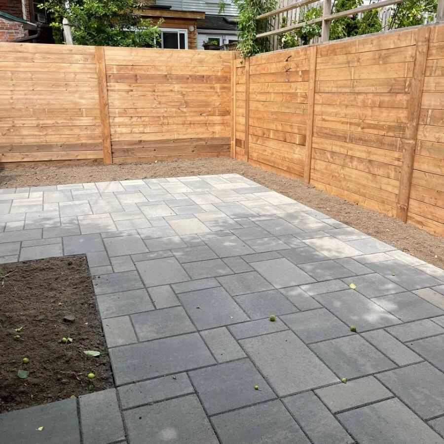 Maintained interlocking patio with clean joints and protected stone surface